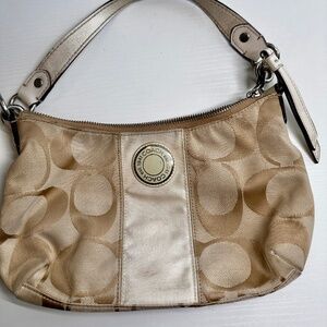 Beige Vintage Coach purse.